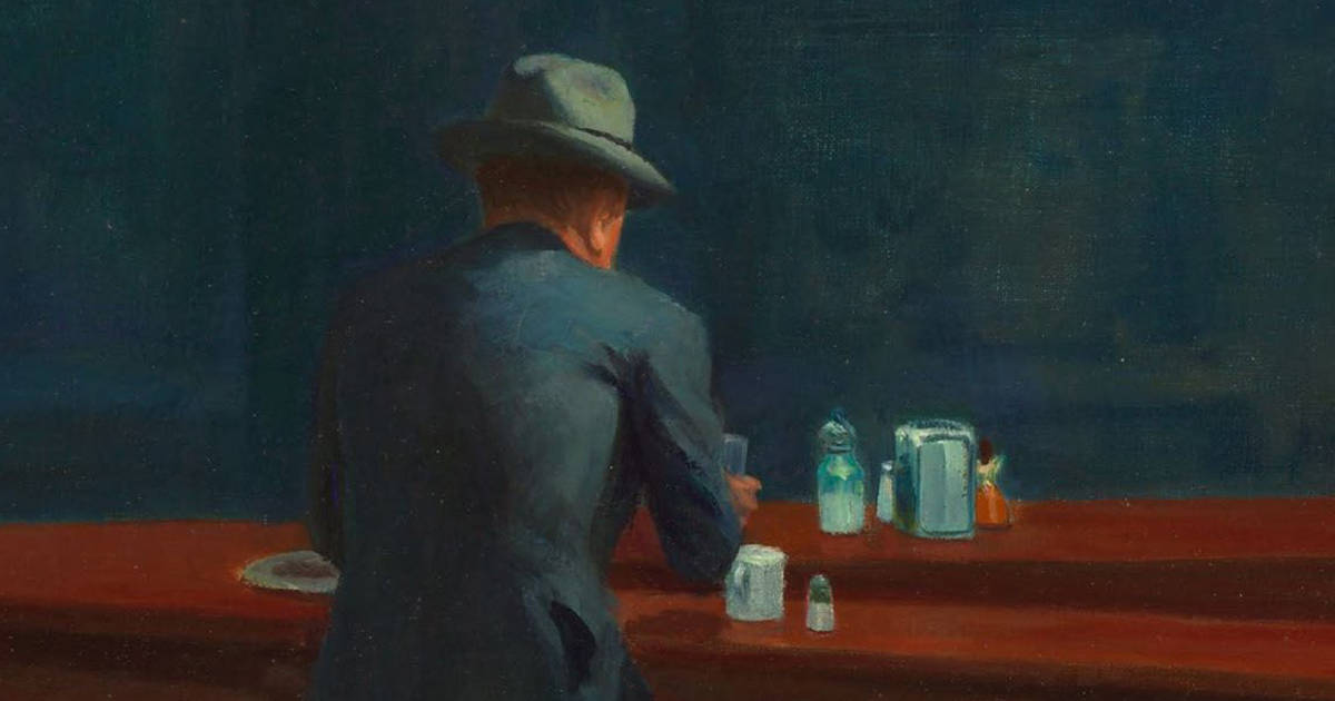 A crop of Hopper's Nighthawks, showing a man in a suit sitting alone at the counter of a diner.