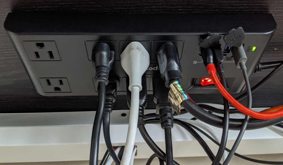The freeport powerstrip mounted under the desk.