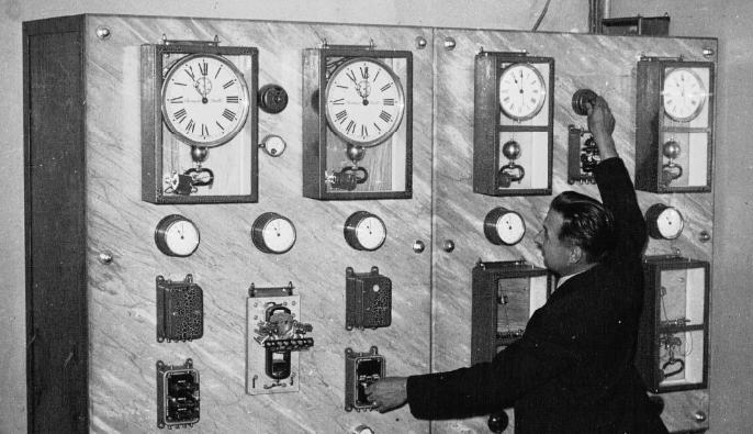 A man adjusts the central time of the Gare Saint-Lazare in Paris, 1937. 